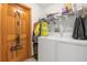Laundry room with washer, dryer, and ample storage at 897 Vicksburg St, Deltona, FL 32725
