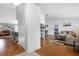 Open concept living area with wood floors and views into adjacent rooms at 897 Vicksburg St, Deltona, FL 32725