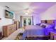 Spacious bedroom with a king-size bed and access to backyard at 897 Vicksburg St, Deltona, FL 32725