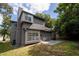 Gray house exterior with solar panels and patio at 1509 Red Oak Ct, Apopka, FL 32703