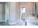 Bathroom with double vanity and access to closet at 1509 Red Oak Ct, Apopka, FL 32703