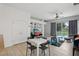 Gathering room with pool view, white table, and gray chairs at 16838 Glenbrook Blvd, Clermont, FL 34714