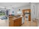Kitchen with island, wood cabinets, and view of pool at 16838 Glenbrook Blvd, Clermont, FL 34714