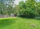 Fenced backyard with lush green grass at 1129 Crestview Ave, Lakeland, FL 33805