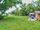 Large grassy backyard, partially fenced at 1129 Crestview Ave, Lakeland, FL 33805