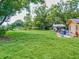 Large grassy backyard with mature trees at 1129 Crestview Ave, Lakeland, FL 33805