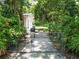 Private backyard access through a gate, featuring a picnic table at 1129 Crestview Ave, Lakeland, FL 33805