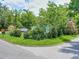 Neatly landscaped front yard with green grass and shrubs at 1129 Crestview Ave, Lakeland, FL 33805
