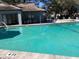 Community pool with surrounding lounge area at 4559 Oak Arbor Cir, Orlando, FL 32808