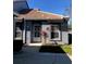 Front view of house, showcasing entrance and landscaping at 4559 Oak Arbor Cir, Orlando, FL 32808