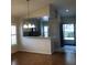 Open kitchen with breakfast bar and access to the dining area at 4559 Oak Arbor Cir, Orlando, FL 32808