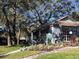 Community clubhouse with landscaping at 4559 Oak Arbor Cir, Orlando, FL 32808