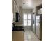 Full kitchen with microwave, stove, and refrigerator at 4559 Oak Arbor Cir, Orlando, FL 32808