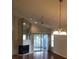 Bright living room with fireplace and sliding glass doors leading to a patio at 4559 Oak Arbor Cir, Orlando, FL 32808