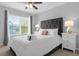 Bedroom with king-size bed, nightstands, and ceiling fan at 2213 San Vittorino Cir # 106, Kissimmee, FL 34741