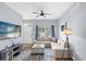 Spacious living room with L-shaped sofa and large TV at 2213 San Vittorino Cir # 106, Kissimmee, FL 34741