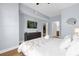 King-size bed and large TV in this spacious Primary bedroom at 2213 San Vittorino Cir # 106, Kissimmee, FL 34741