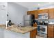 Modern kitchen with stainless steel appliances and granite countertops at 2213 San Vittorino Cir # 106, Kissimmee, FL 34741