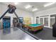 Game room with air hockey, pool table, and arcade games at 2213 San Vittorino Cir # 106, Kissimmee, FL 34741