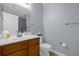 Clean bathroom with wood vanity, toilet and shower at 2213 San Vittorino Cir # 106, Kissimmee, FL 34741