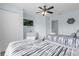 Bedroom with two twin beds, dresser, and TV at 2213 San Vittorino Cir # 106, Kissimmee, FL 34741