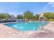 Refreshing community pool surrounded by a spacious patio and lounge chairs at 2213 San Vittorino Cir # 106, Kissimmee, FL 34741