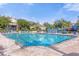 Community pool with ample deck space and comfortable seating at 2213 San Vittorino Cir # 106, Kissimmee, FL 34741