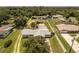 Aerial view showing home, pool, and outbuildings at 8342 Starr Dr, Orlando, FL 32818