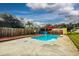 Relaxing pool area with a wooden deck, and a covered patio with bar at 8342 Starr Dr, Orlando, FL 32818
