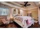 Main bedroom with a white sleigh bed and pink accents at 8342 Starr Dr, Orlando, FL 32818