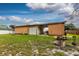 Large workshop with covered carport and roll-up door at 8342 Starr Dr, Orlando, FL 32818