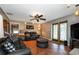 Comfortable living room with leather sofas and a large TV at 8342 Starr Dr, Orlando, FL 32818