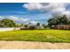 Large backyard with lush green grass and a wooden gazebo, perfect for outdoor enjoyment at 8342 Starr Dr, Orlando, FL 32818