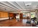 Sunroom with tiled floor, access to pool, and wicker furniture at 8342 Starr Dr, Orlando, FL 32818