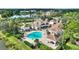 Resort-style pool with cabanas and lush landscaping at 14037 Fairway Island Dr # 233, Orlando, FL 32837