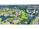 Aerial view highlighting condo location near golf course and lake at 14037 Fairway Island Dr # 233, Orlando, FL 32837