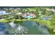 Community features a lake, pool, clubhouse, and lush landscaping at 14037 Fairway Island Dr # 233, Orlando, FL 32837