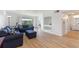 Living room features hardwood floors and access to balcony at 14037 Fairway Island Dr # 233, Orlando, FL 32837