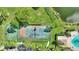 Aerial view of tennis and basketball courts, pool, and clubhouse at 14037 Fairway Island Dr # 233, Orlando, FL 32837