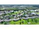 Aerial view highlighting condo location near lake and green space at 14037 Fairway Island Dr # 233, Orlando, FL 32837