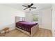 Cozy bedroom with ceiling fan and wood-look flooring at 14037 Fairway Island Dr # 233, Orlando, FL 32837