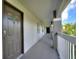 Condo hallway with dark brown door and white walls at 14037 Fairway Island Dr # 233, Orlando, FL 32837