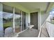 Private balcony with patio furniture and view of green space at 14037 Fairway Island Dr # 233, Orlando, FL 32837