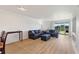 Bright living room with hardwood floors and view to balcony at 14037 Fairway Island Dr # 233, Orlando, FL 32837