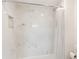 Bathroom with a shower/tub combo and marble tile surround at 14037 Fairway Island Dr # 233, Orlando, FL 32837