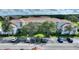 Aerial view of condo building with parking and landscaping at 14037 Fairway Island Dr # 233, Orlando, FL 32837