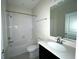 Guest bathroom with a single vanity and bathtub at 8502 Arcadia Ln, Davenport, FL 33896