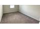 Bright bedroom with neutral walls and carpeted floors at 8502 Arcadia Ln, Davenport, FL 33896