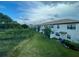 View of townhomes and lush green landscaping at 8502 Arcadia Ln, Davenport, FL 33896