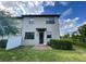 Private backyard with patio and lush landscaping at 8502 Arcadia Ln, Davenport, FL 33896
